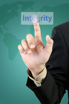 businessman hand touching intergrity button