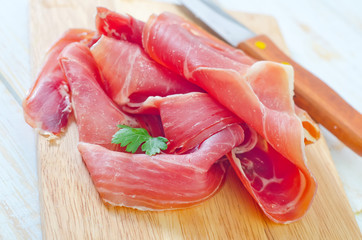 Proscuitto on a wooden board