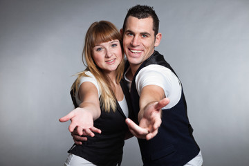 Obraz premium Beautiful young couple man and woman in love. Studio.