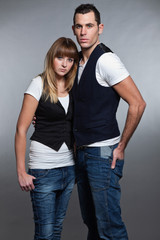 Beautiful young couple man and woman in love. Studio.