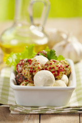 fresh cheese balls with oil and spices