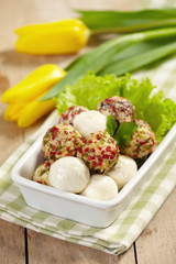 fresh cheese balls with oil and spices