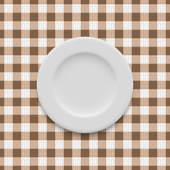 realistic empty plate on the tablecloth