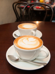 two cappuccino cups