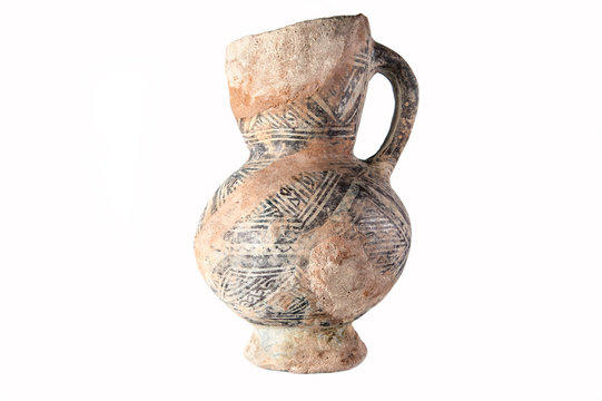 Clay old Middle Eastern jug on the white background