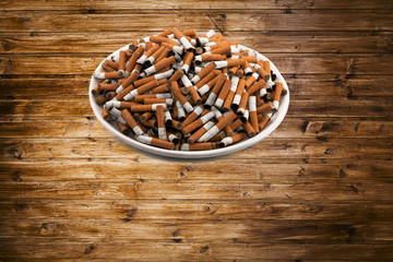 white ceramic plate with cigarettes