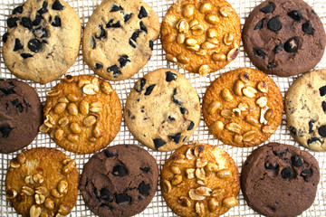 cookies with chocolate and peanuts on a linen cloth