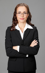 Smiling businesswoman, over gray