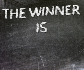 The Winner is Chalk Text on Blackboard 