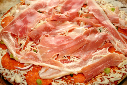 Prosciutto on Top of a Raw Meat Pizza
