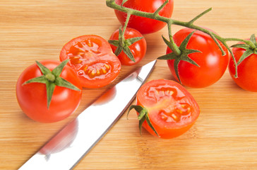 Tomatoes and kitchen knife blade