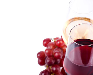 wine glasses with red and white wine and grapes