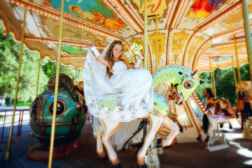 beautiful bride riding a carousel