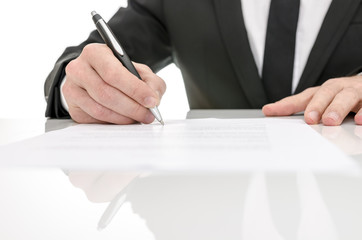 Front view of a business man signing a contract