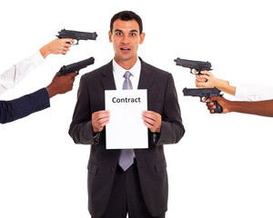 businessman holding forced contract at gun point