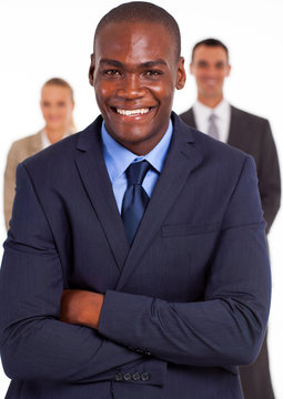 handsome african american businessman in front of team