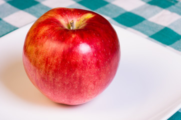 Tokyo Rose apple on white plate