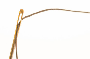 Metal sewing needle with thread