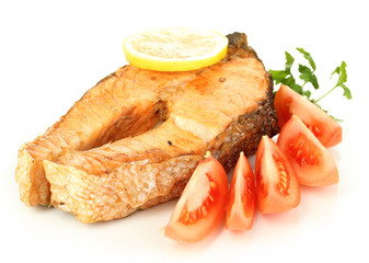 Appetizing grilled salmon with lemon and vegetables isolated