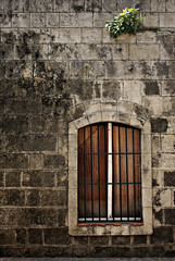 Barred Window on an Old Wall in Intramuros, Manila