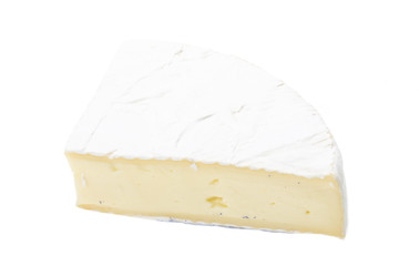 A piece of soft brie cheese