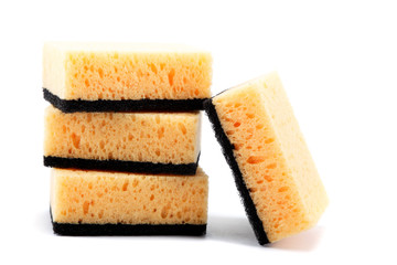 Stack of cleaning sponges on a white background.