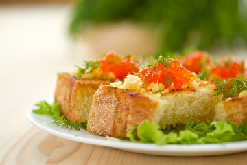 Fried toast with cheese and red caviar