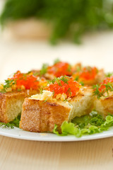 Fried toast with cheese and red caviar