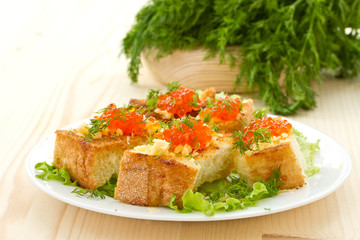 Fried toast with cheese and red caviar