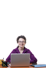Girl making fun at an office table isolated on white