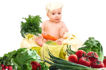Cute baby chef with big pot and vegetables