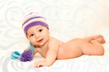 Newborn baby in blue knitted cap