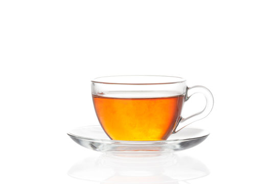 Cup of tea with saucer on white background
