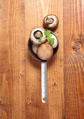 Fresh whole mushrooms in a saucepan