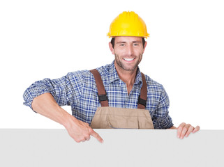 Construction worker presenting empty banner