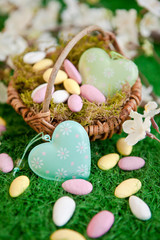 Fototapeta premium Easter nest with easter nest on green