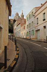 street in Marseille with the view at  Notre Dame de la Garde © olezzo