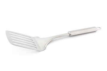 Silver spatula on white
