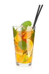 Glass of ice tea with lemon, lime and mint
