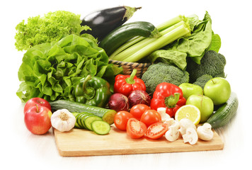 Composition with raw vegetables isolated on white