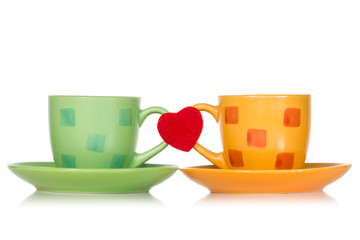Two cups with red heart