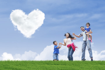 Family stroll and heart clouds