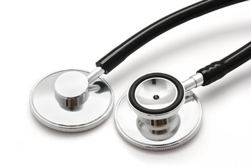 Two black stethoscopes isolated on white