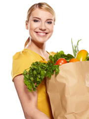 Young woman with a grocery shopping bag. Isolated on white backg