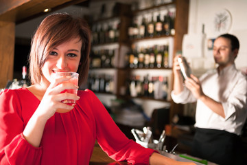 Woman drinking a cocktail