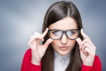 Confident businesswoman with nerd glasses