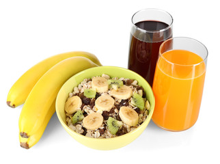 Delicious and healthy cereal in bowl with juice and fruit