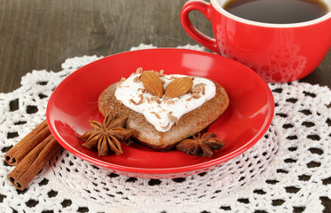 Chocolate cookie in form of heart with cup of coffee