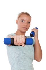 Young woman with dumbbells