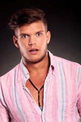 posing surprised while looking at you